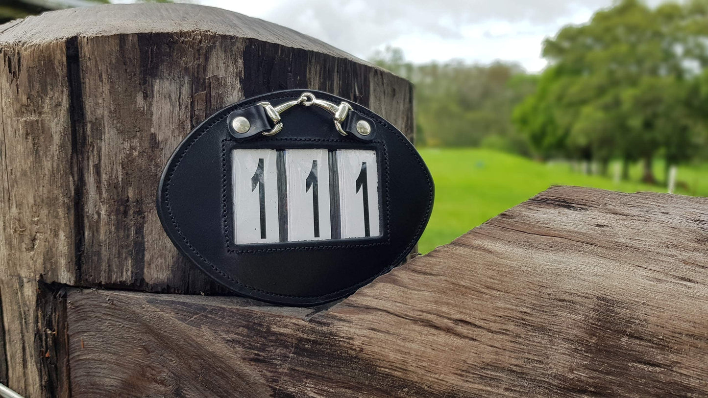 Echo Beach Equestrian Genuine Leather Number Holder Pair for Bridle or Saddle Pad. Oval with 3 Digit Easy Change Numbers. Built in Clip for Secure Attachment. 2 Number Holders Included