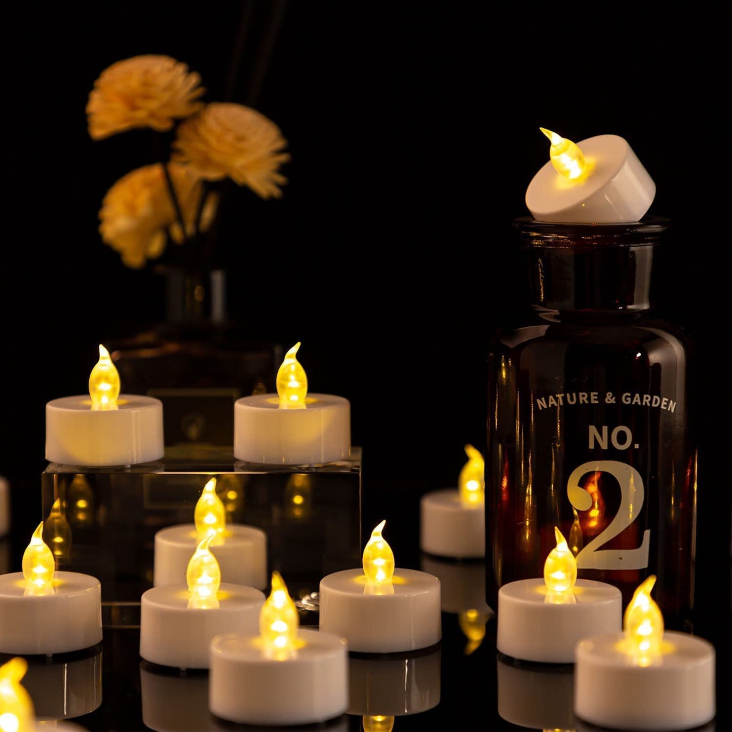 Hanzim LED Tea Lights Candles- 100PACK Warm Yellow Flameless Candles Realistic and Bright Flickering Long Lasting 200Hours for Holiday Celebration,Party,Home Decoration,Battery Operated