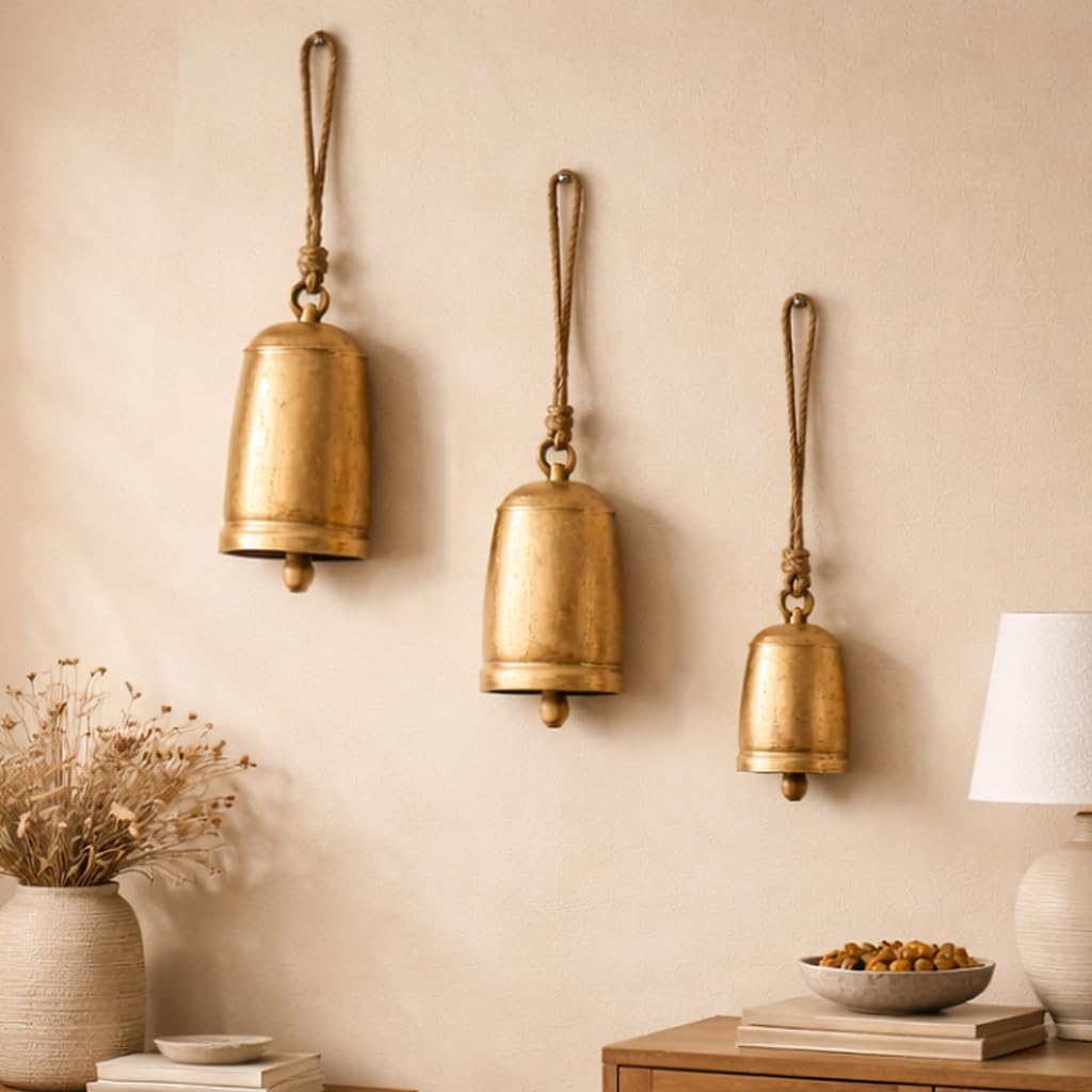 Deco 79 Metal Tibetan Inspired Decorative Cow Bells with Jute Hanging Rope, Set of 3 10", 7", 5"H, Gold