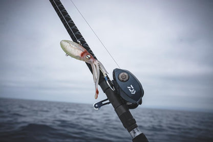 Nomad Design Squidtrex Patented Vibrating Fishing Lure- Scent Added TPE Soft Plastic Lure for Saltwater w/Strong BKK Assist Hooks, Fishing Bait that Catches Many Species, 130mm 5" 3 1/4oz- White Glow