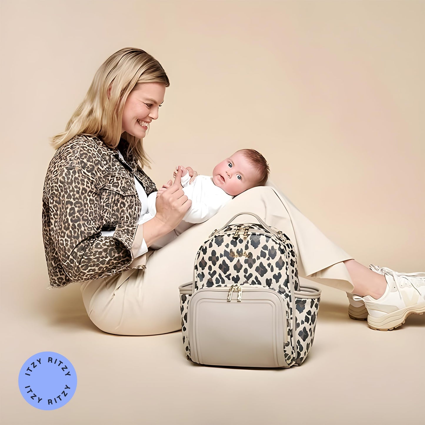 Itzy Ritzy Mini Diaper Bag Backpack – Chic, Compact Mini Plus Backpack with Changing Pad, 10 Pockets (6 Internal, 4 External), Grab-Top Handle & Rubber Feet (Leopard)