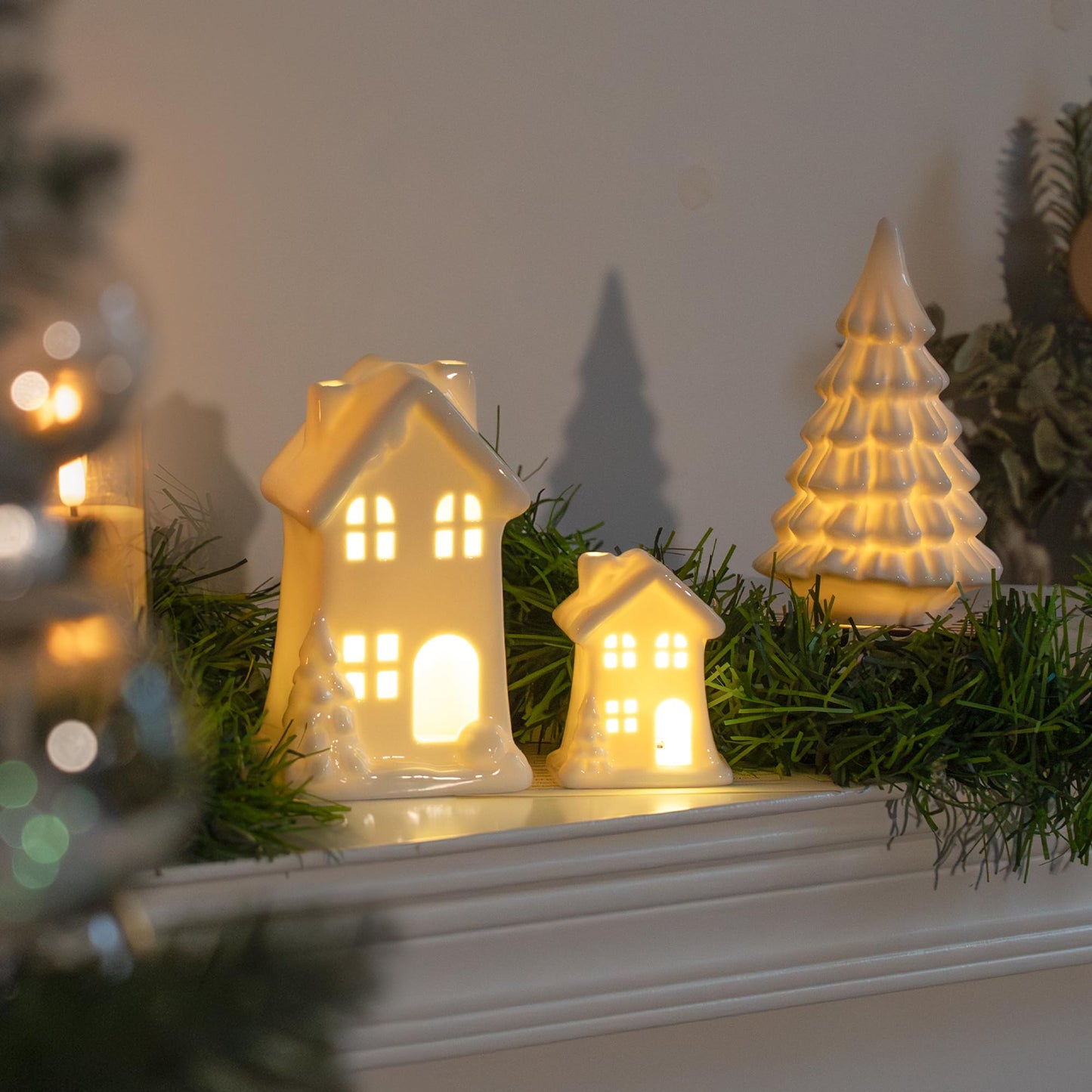 NEROSUN Ceramic Christmas Village Houses, 3Pcs LED Lighted Porcelain White Small House and Xmas Tree Tabletop Figurines, Light Up Christmas Decorations for Home Shelf Cabinet Table Winter Decor