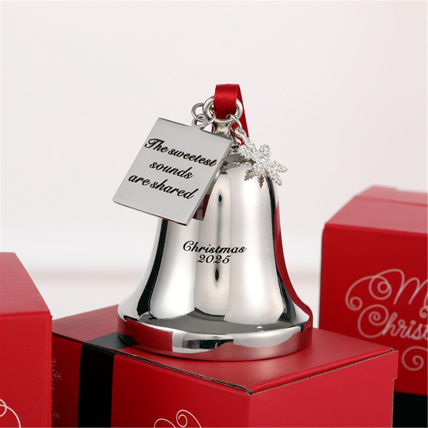 FKOG Christmas Bell Ornament 2026, Silver Metal with Snowflake Charm, Red Ribbon, Quote - The Sweetest Sounds are Shared Design, Holiday Tree Decoration, 3x2.4x2.4 Inches (Silver)
