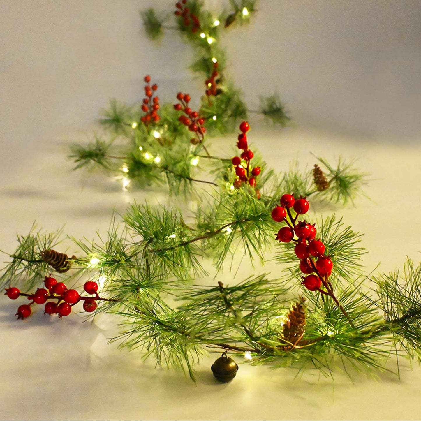 PALONMY Christmas Garland Lights 6.56 FT Smokey Pine Garland with 30 LED Fairy Lights Battery Operated Garland Lights with Red Berries Bells Pine Cones Christmas Indoor Home Decorations