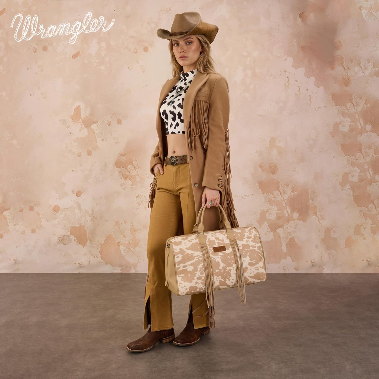 Wrangler Rustler Wildside Cow-Print Weekender Duffel Bag Large Carry On Bags with Tassels, Tan