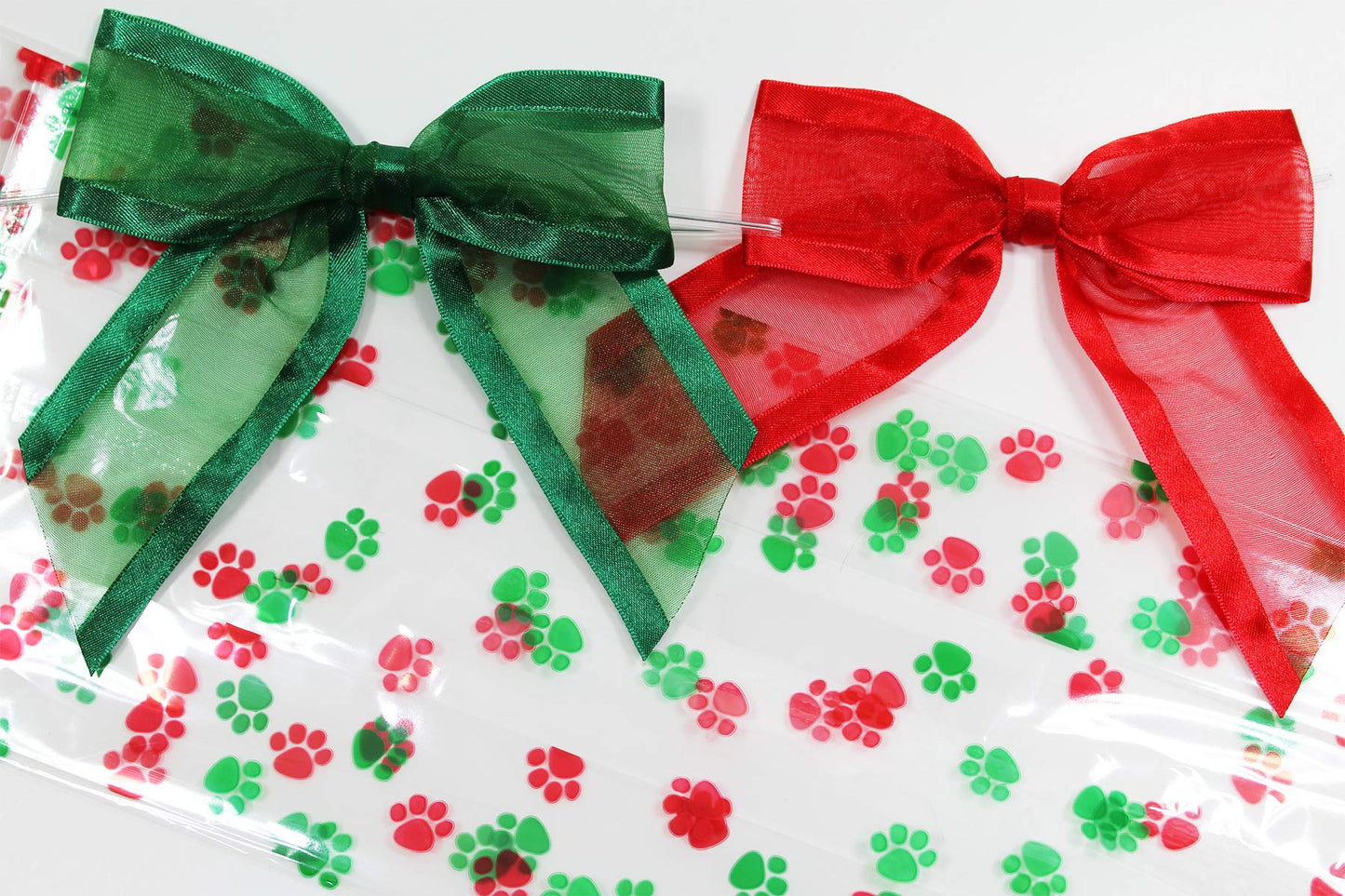 Saybrook Products Christmas Dog Paw Print Holiday Cellophane Treat Party Favor Bags with Twist-Tie Organza Bow. Set of 10 Ready-to-Use, Gussetted 11x5x3 Goodie Bags with Red & Green Bows.