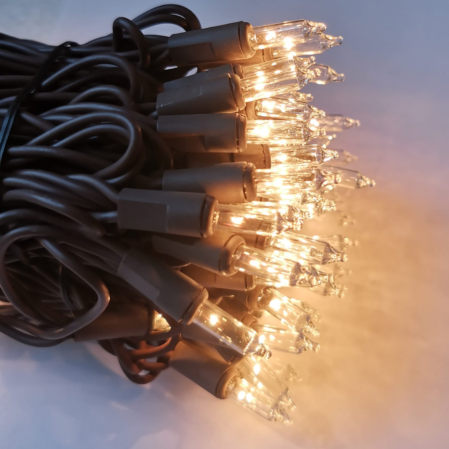 MXTCLM 100 Clear Mini Brown Wire Christmas Lights 23ft Incandescent Waterproof UL Certified Fairy String Lights for Outdoor Indoor Home Party Holiday Xmas Tree Decoration