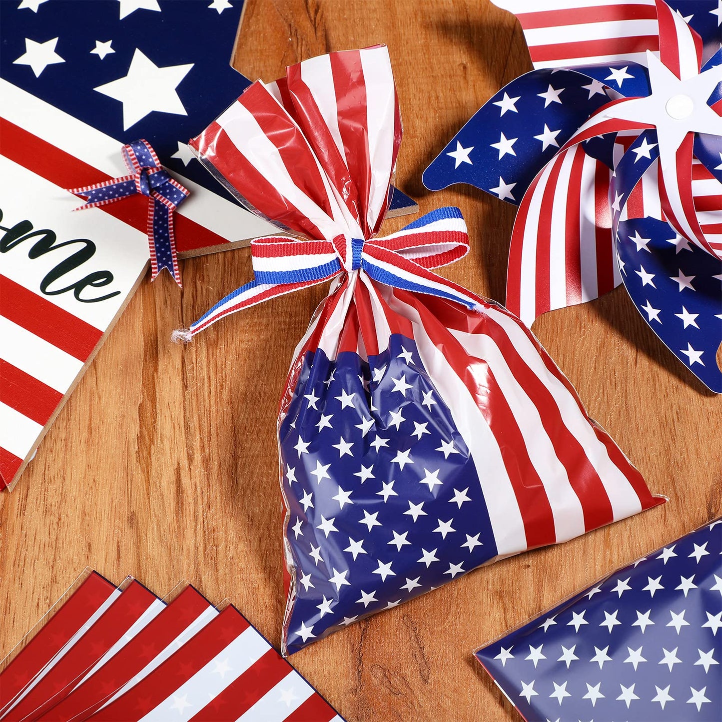 Tenare 100 Pcs Patriotic Gift Cellophane Bags Bulk 4th of July Plastic Red White Blue Flag Treat Goodie Bags 250th Anniversary Treat Goodie Candy Pouches with Ribbon for Independence Day Party Favors
