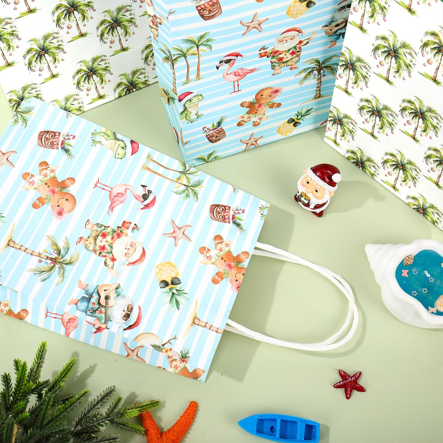 JarThenaAMCS 16 Pcs Summer Christmas Paper Gift Bag Watercolor Xmas in July Coconut Tree Santa Claus Treat Bags with Handles Tissue Paper Tropical Candy Goodie Bags for Holiday Party Favors Supplies