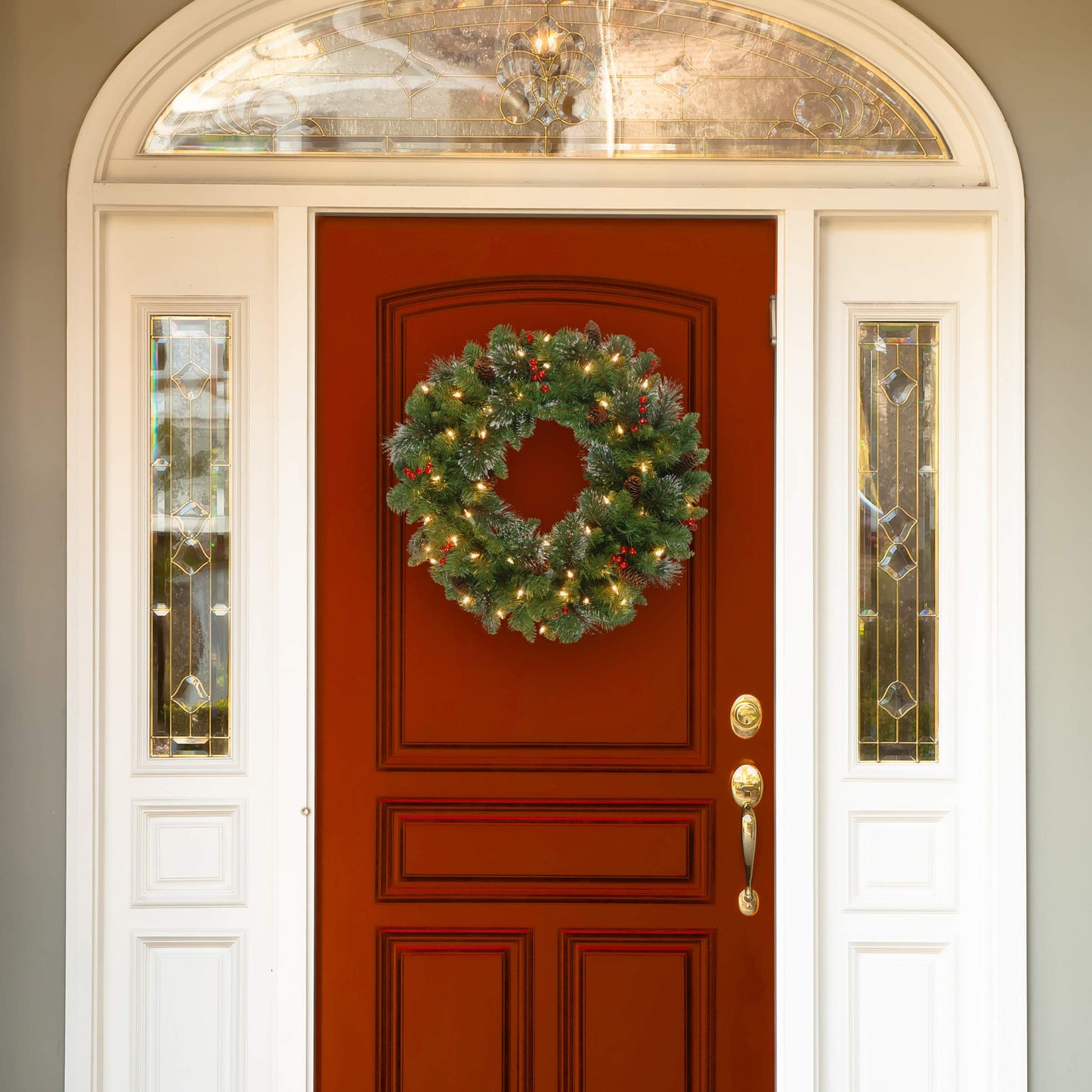 National Tree Company 24 in Pre-Lit Crestwood Spruce Artificial Christmas Wreath, Christmas Decoration with Glitter, Pinecones, Red Berries, 50 Clear Lights, 160 Tips, Green