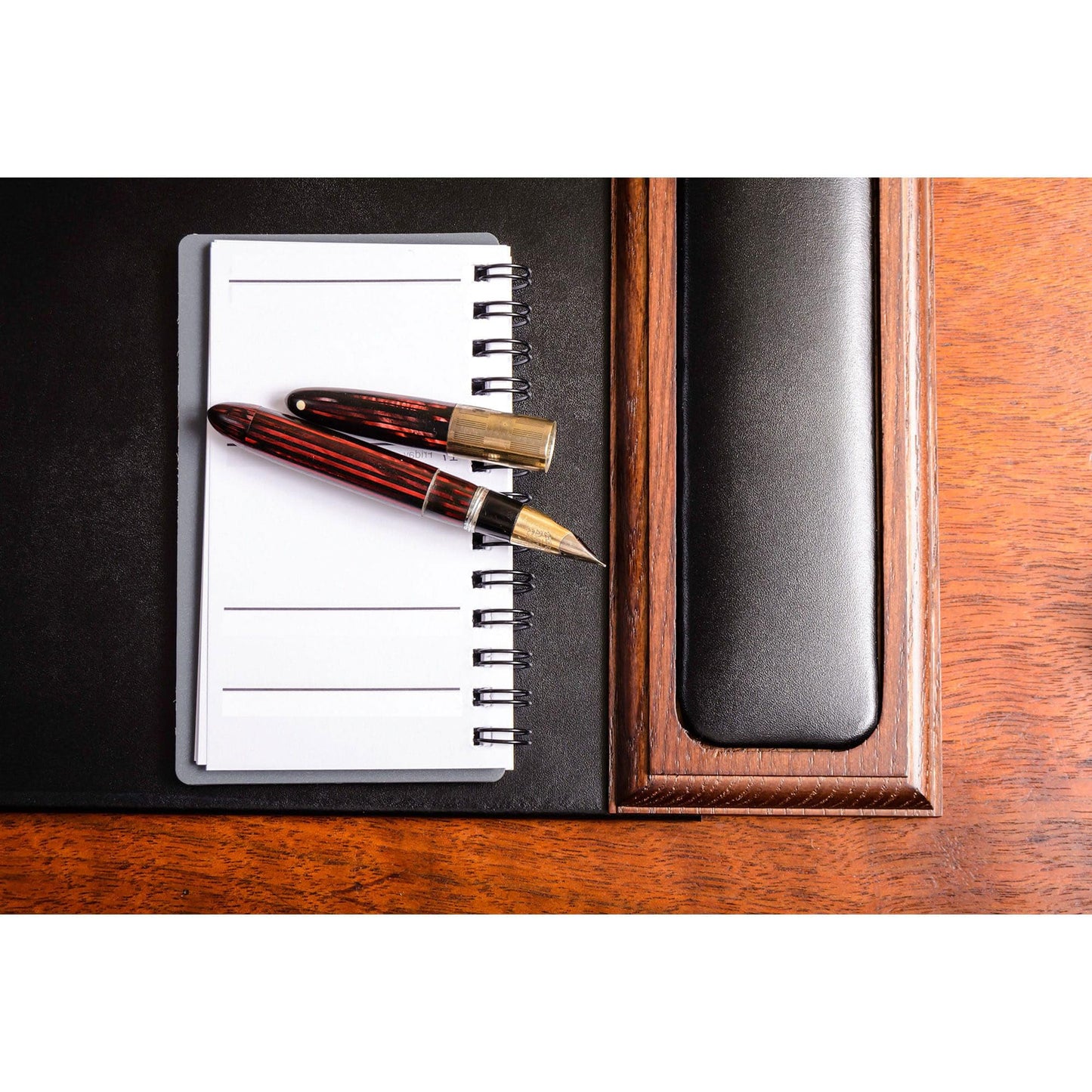 DACASSO Wood & Leather Desk Pad with Side Rails - Luxury Leather Desk Blotter for Writing - Padded Executive Desk Surface Protector - (Walnut & Black, 34” x 20”)