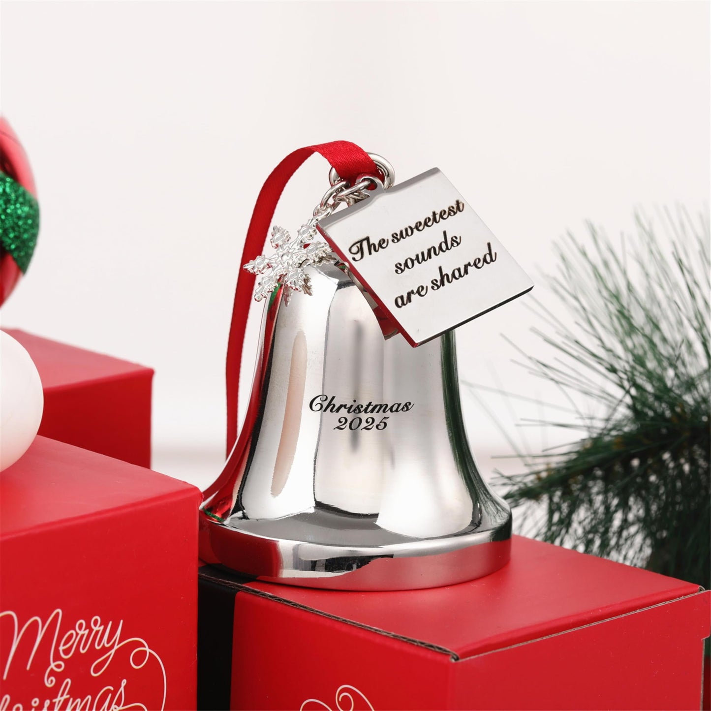 FKOG Christmas Bell Ornament 2026, Silver Metal with Snowflake Charm, Red Ribbon, Quote - The Sweetest Sounds are Shared Design, Holiday Tree Decoration, 3x2.4x2.4 Inches (Silver)