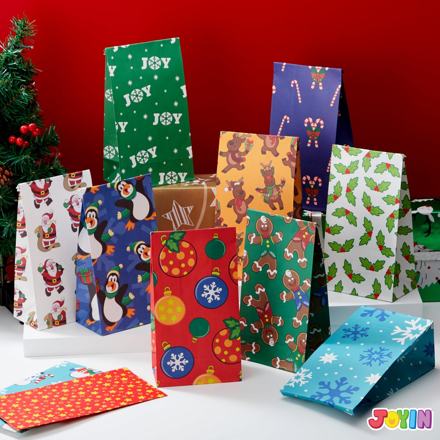 Joiedomi 72 PCS of Christmas Goody Kraft Bags, 12 Assorted Xmas Designs Small Holiday Goodie Gift Bags for Classrooms Party Favors, Christmas Craft Party Treat (9.75" x 3" x 5")