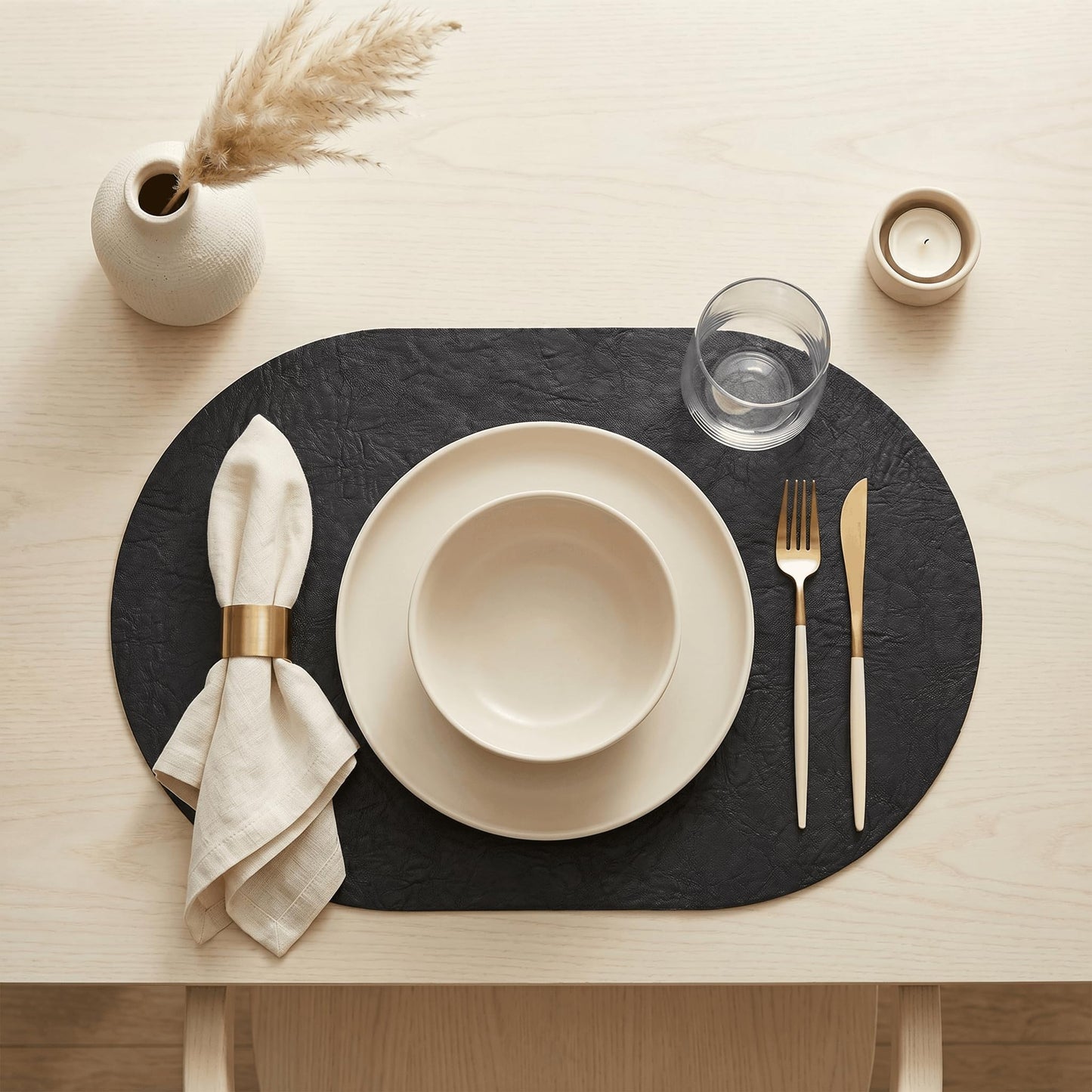 Artoid Mode Black Faux Leather Oval Placemats Set of 6, 12 x 18 Inch Waterproof Wipeable Heat Resistant Vinyl Place Mats, Reversible Table Mats for Kitchen Dining Decor