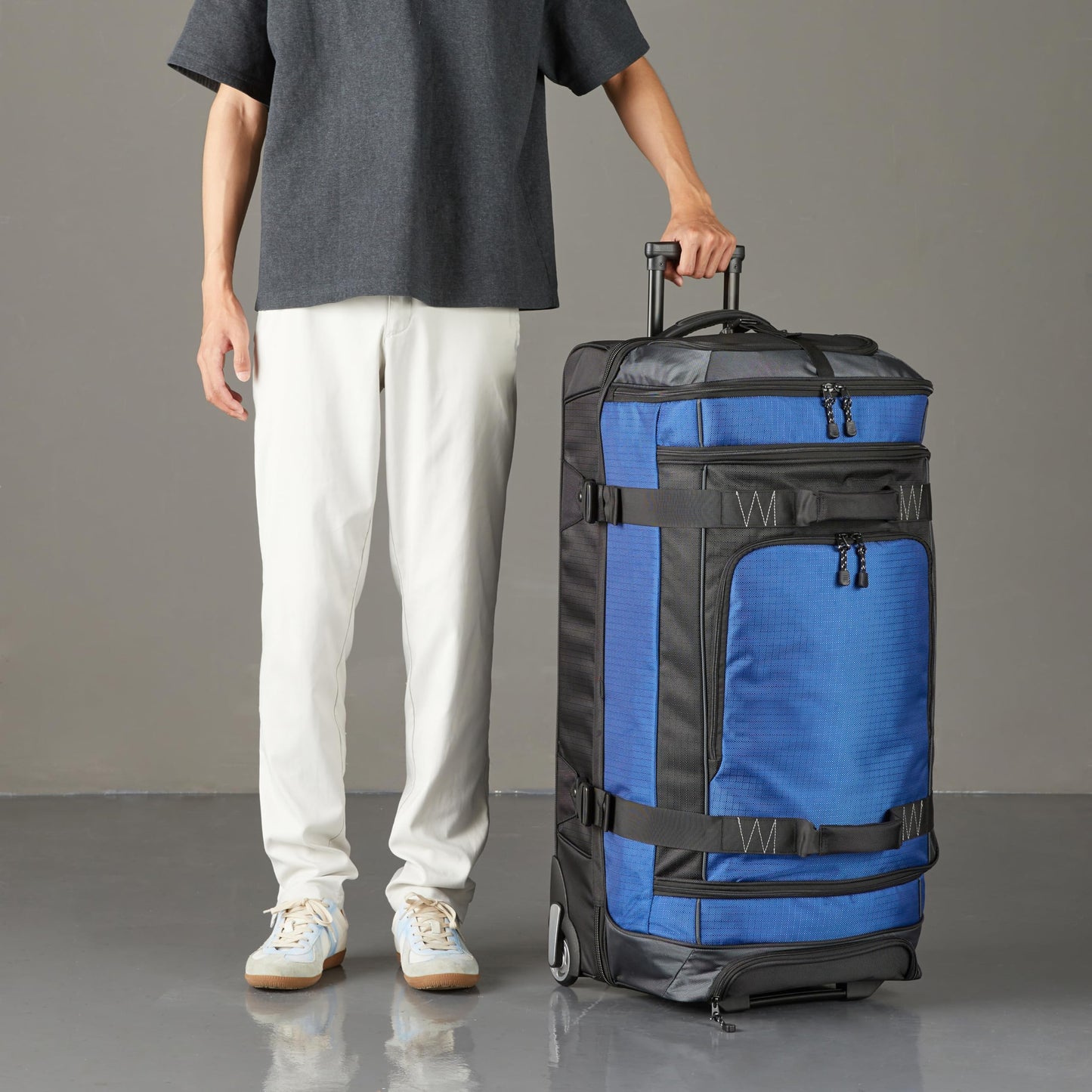 Amazon Basics 35-Inch Large Rolling Duffel Bag for Travel with Wheels and Handle, Durable Ripstop Polyester, 2 Layers of Space, Multiple Interior and Exterior Pockets, Blue