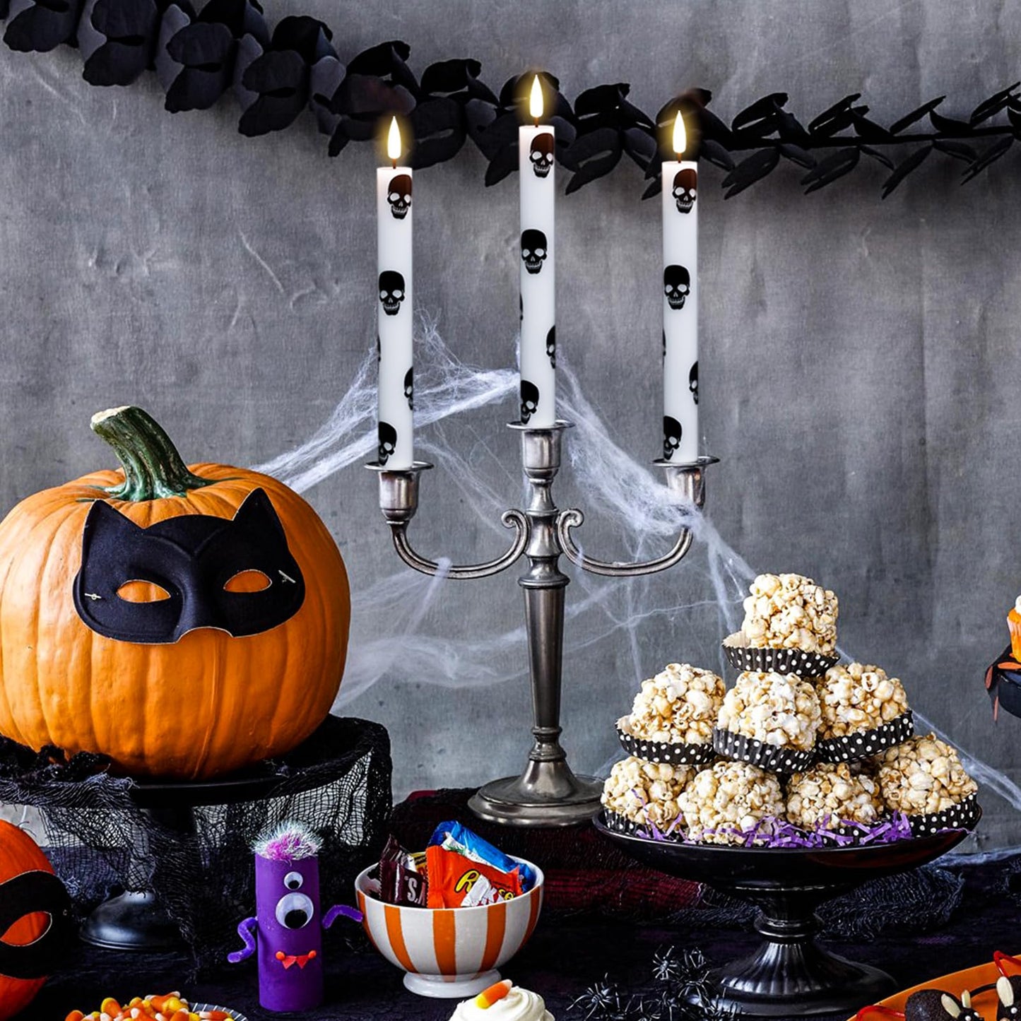 GenSwin Halloween Flameless Taper Candles Remote Timer, 4 Pack Real Wax LED Taper Candles Battery Operated Flickering with Skull Prints, Flameless Candlesticks for Halloween Decor(0.75”x 9.65”)