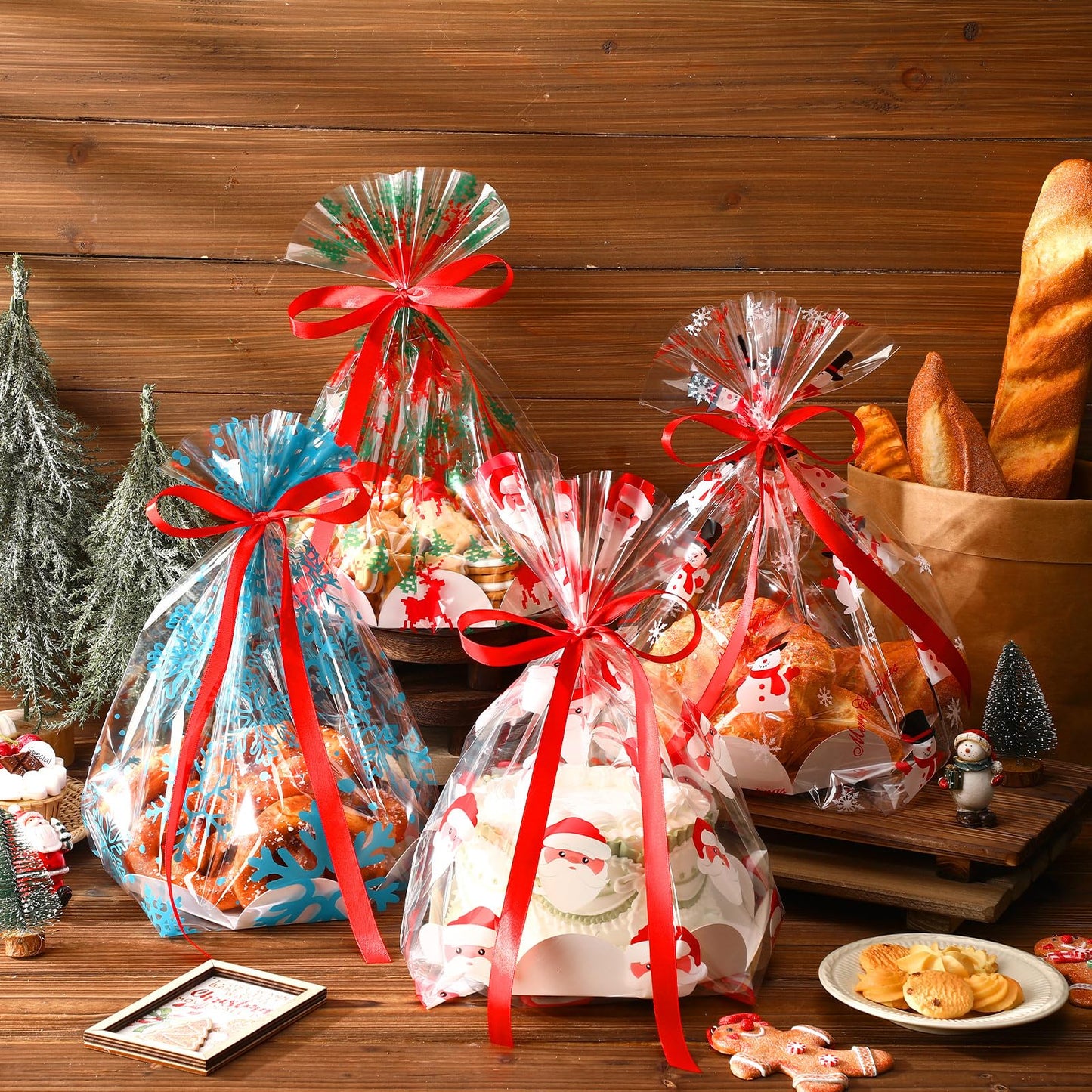 Sunnychicc 24 Pack Christmas Clear Plastic Bake Bags with 8'' Cake Tray Red Ribbon Bakery Gift Packaging Santa Snowman Elk Snowflake Pattern Cellophane Treat Bags for Toast Bread Cookies Candy Food