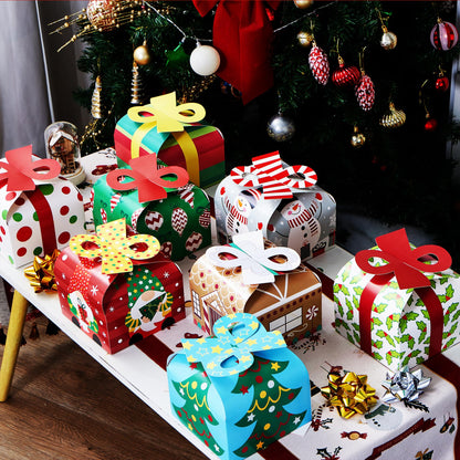 JOYIN 24 PCS 3D Christmas Goody Gift Boxes with Bow for Holiday Xmas Goodie Paper Boxes, School Classroom Party Favor Supply, 6” x 6” x 5.5” 8 Designs Candy Treat Cardboard Cookie Box for Gift Giving